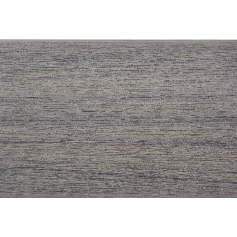 Surface en bois gris texturé horizontalement.